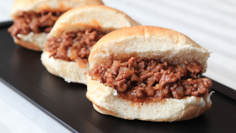 Sloppy Joe sliders sit on a tray.