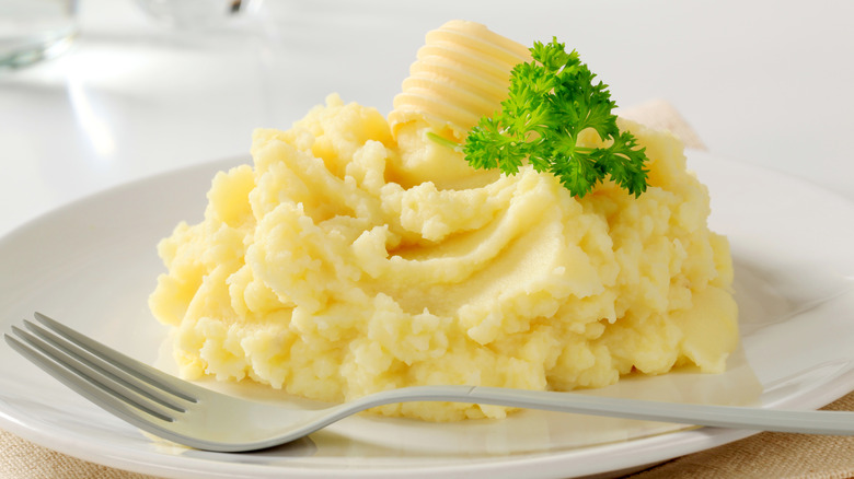 Mashed potatoes on plate with fork