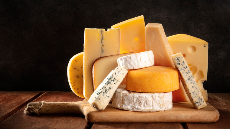 variety of cheeses on board