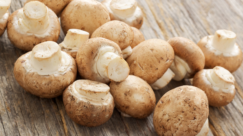 Cremini mushrooms on board