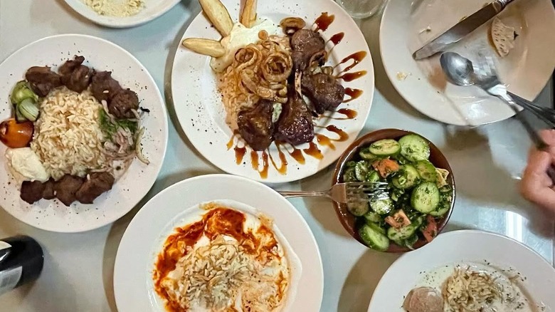 top down shot of several middle eastern dishes on a table