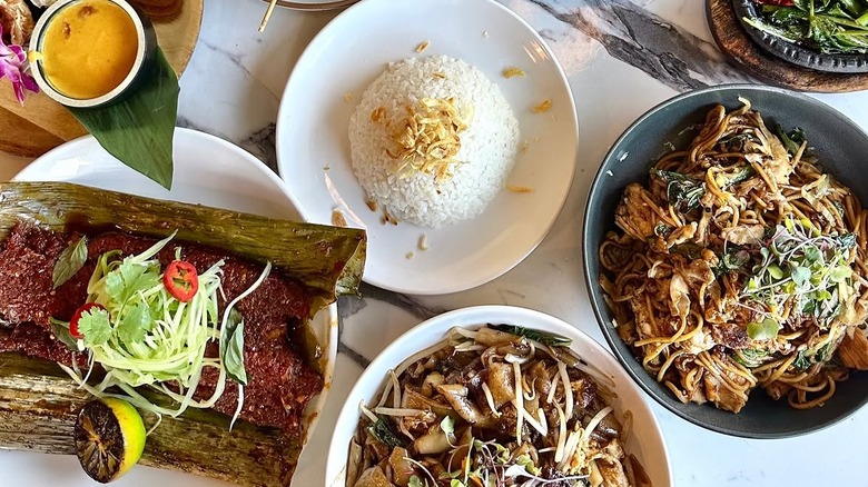 top down table shot full of indonesian dishes