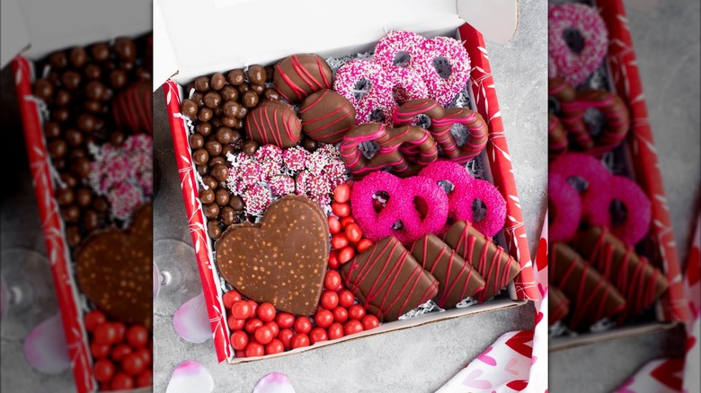An open Sugar Plum Valentine's Day Chocolate and Treats Box displays the treats inside