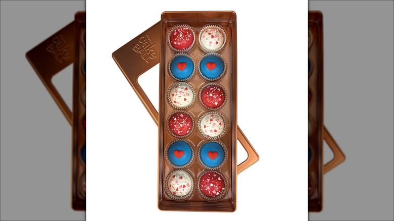 An open tin box of Austin Cake Balls