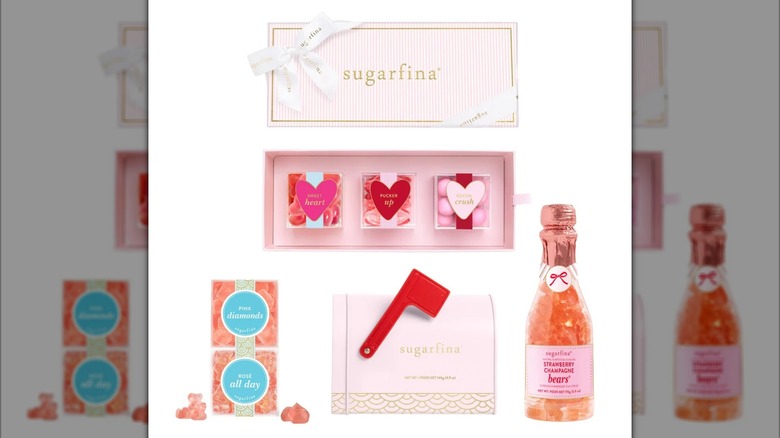 The different components of a Sugarfina Valentine's Day Candy Bundle sit against a white background