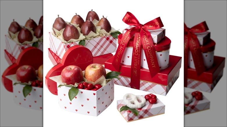 A complete Heart of Hearts Valentine's Day Tower sits beside open packages from the gift set