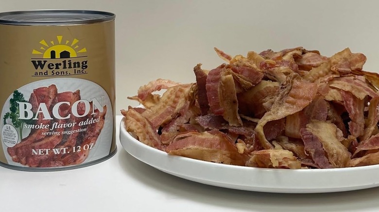 A plate of canned bacon sits next to the can
