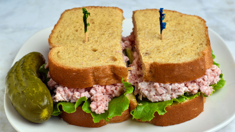 Ham salad sandwich with a pickle