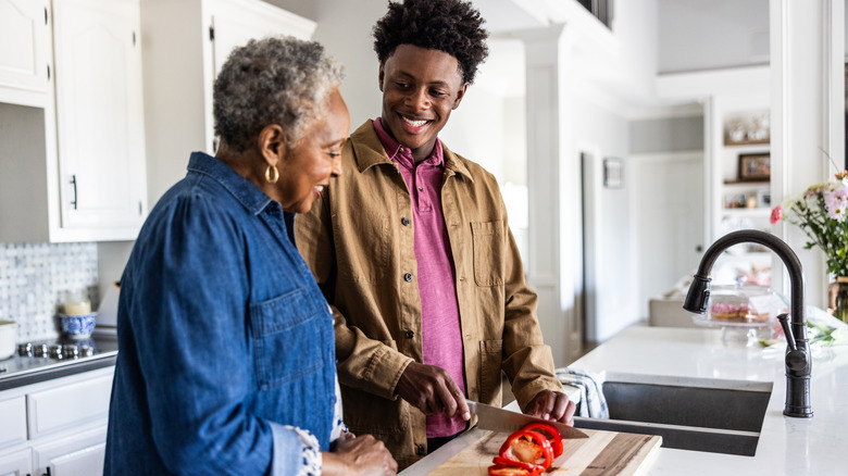 man cooking with grandma