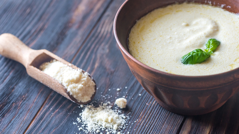Parmesan with bowl of alfredo