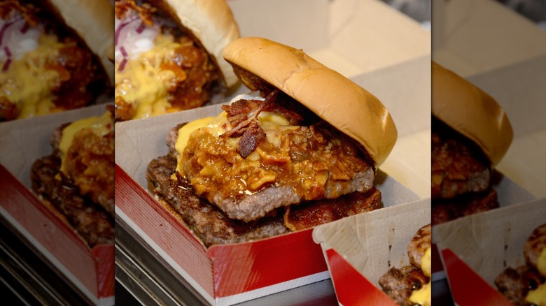 A Wendy's Baconator topped with chili