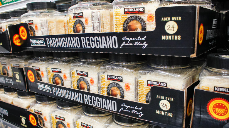 Display of large Kirkland Signature Parmigiano Reggiano Cheese containers