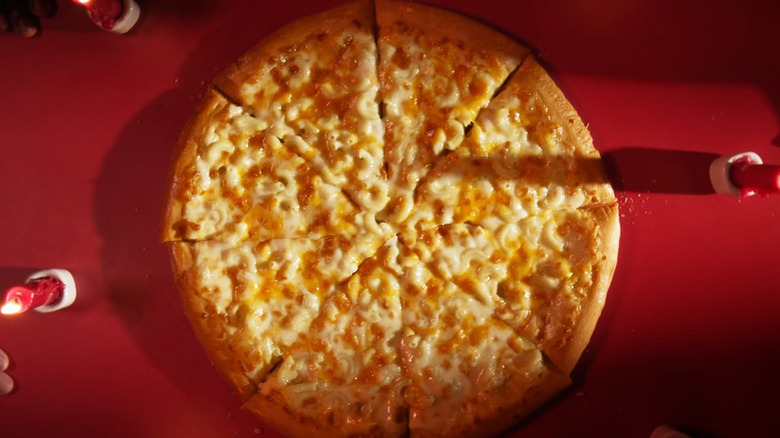 A cheesy pizza from Toppers that's topped with pasta.