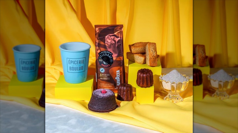The contents of the Coffee Lovers Cookie + Coffee Gift Box arranged against a yellow backdrop.