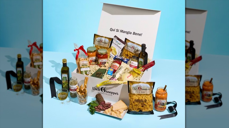 Open Premium Italian Gift Box displaying pastas, sauces, cheeses, olives oils, and more.