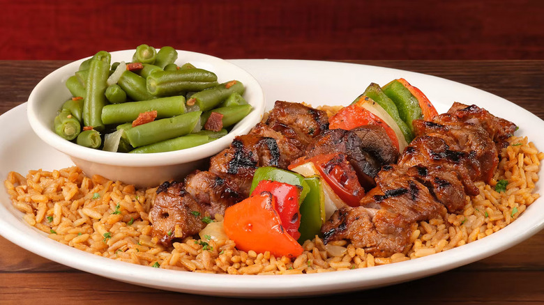 Steak Kabob with rice and a side of string beans