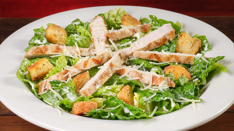 Chicken Caesar Salad in a white ceramic bowl