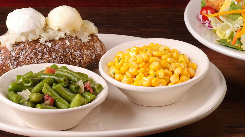 The Country Vegetable Plate including baked potato, corn, and string beans