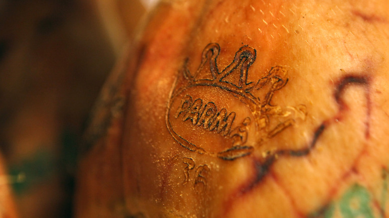 Closeup of whole prosciutto di Parma leg with seal
