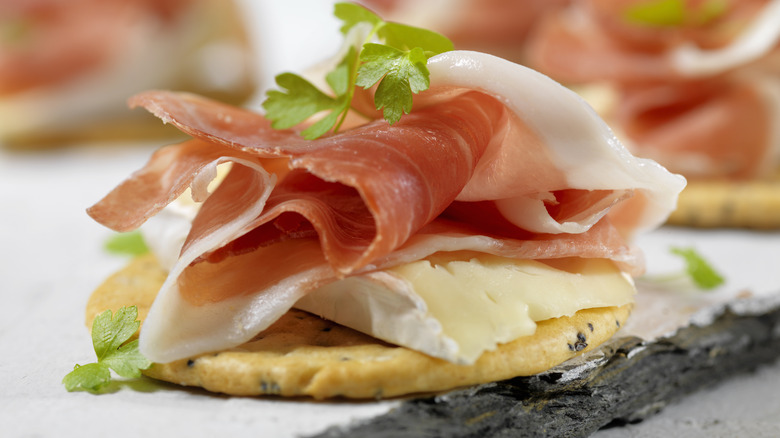 Prosciutto and brie on a cracker