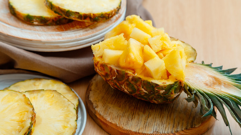 pineapple pieces inside halved pineapple