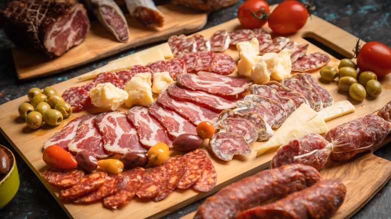 Charcuterie board with cured meats