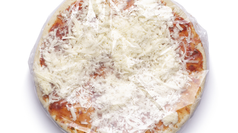 Frozen cheese pizza in wrapper