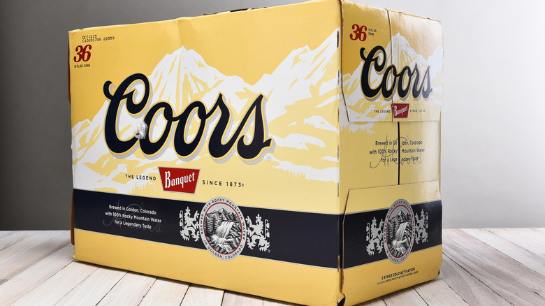 A case of Coors Banquet on a wooden table