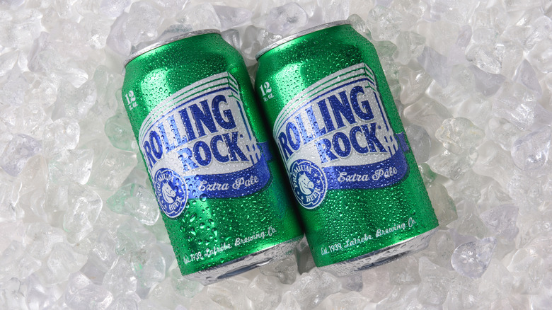 Sweaty cans of Rolling Rock Extra Pale on a bed of ice