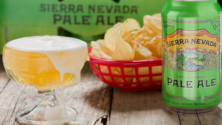 Frothy glass and can of Sierra Nevada Pale Ale