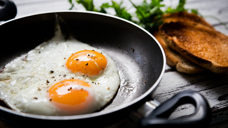 fried eggs in a pan