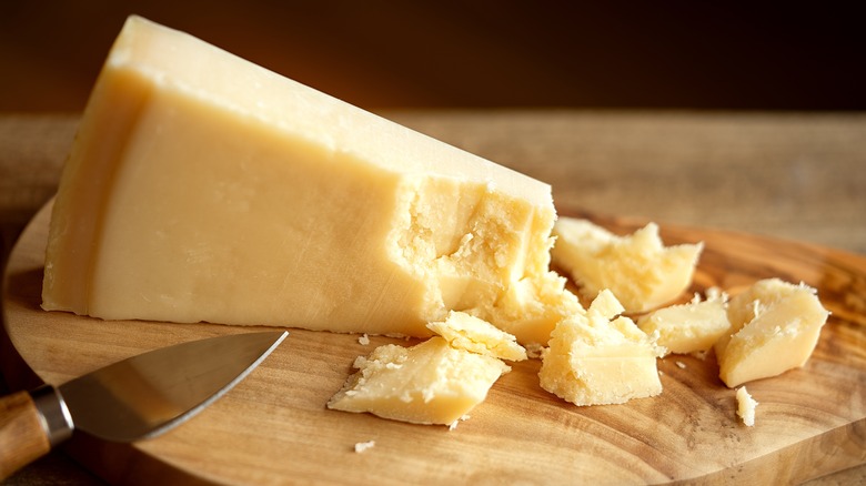 cut cheese on a cutting board