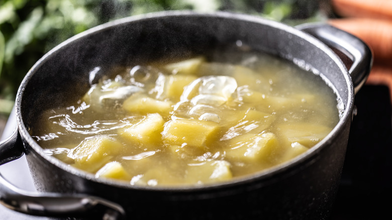 potatoes cooking in potato water