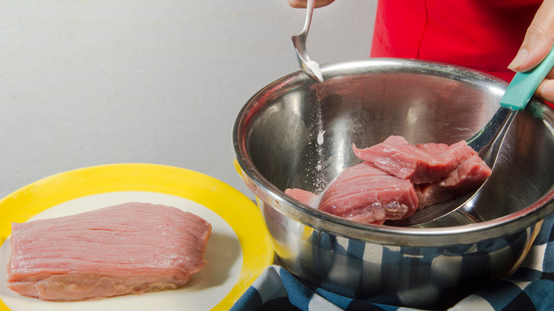 brining meat with baking soda in bowl