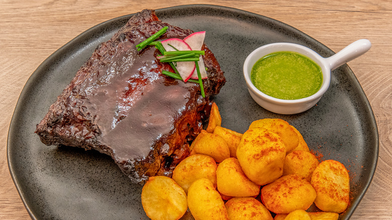 steak on plate with mojo sauce
