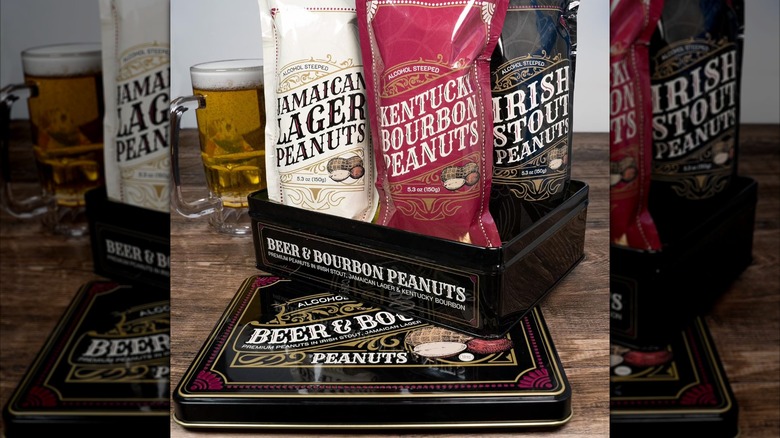 An open Beer & Bourbon Flavored Peanuts Tin with bags of liquor-flavored peanuts displayed.
