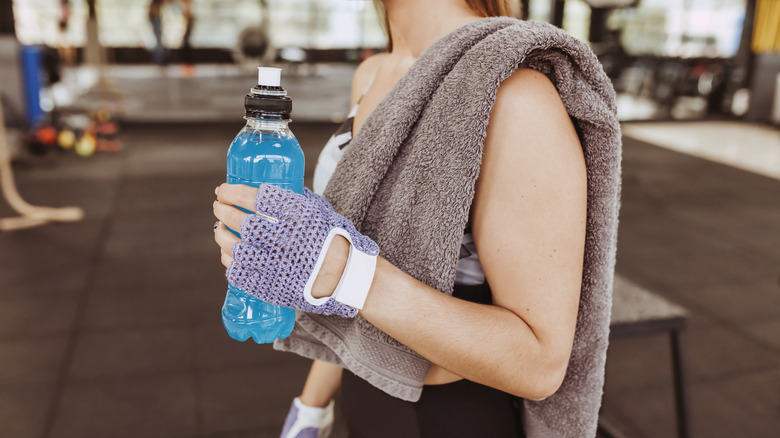 woman holding sports drink