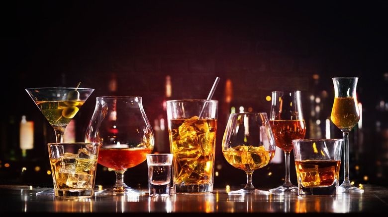 assortment of spirits in glassware