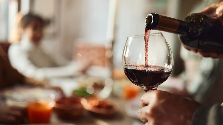 pouring wine into glass