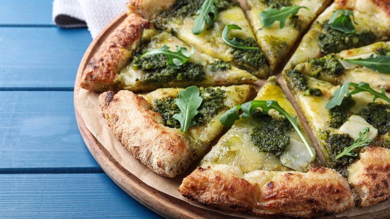 Pizza with pesto and arugula