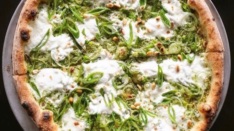 Pizza made with pesto sauce