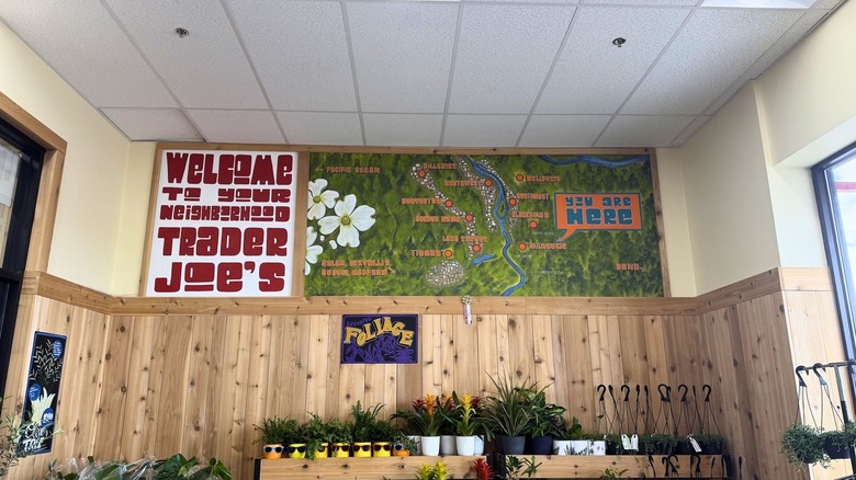 A welcome sign next to a map at Trader Joe's.