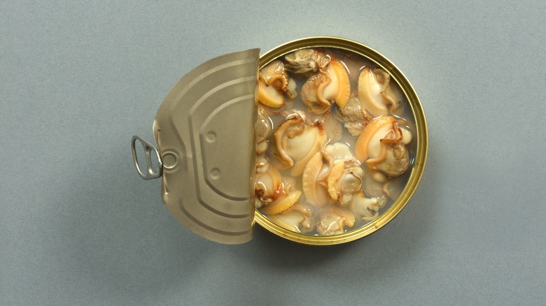 Open can of clams in juice