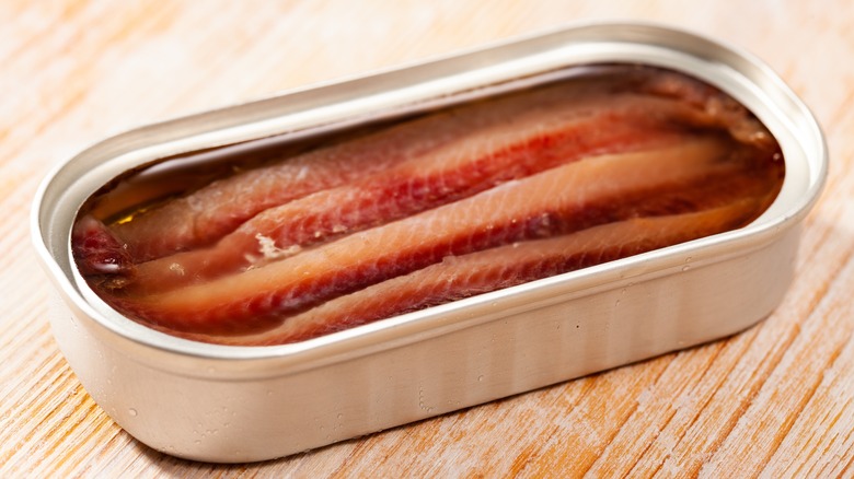 Open can of anchovies in olive oil