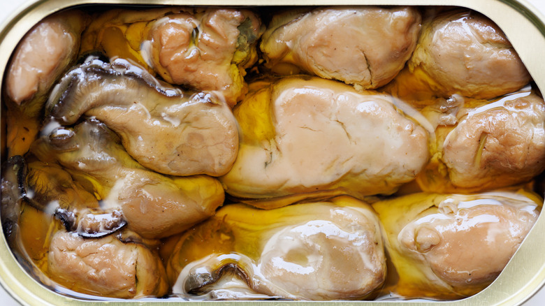 Open can of smoked oysters