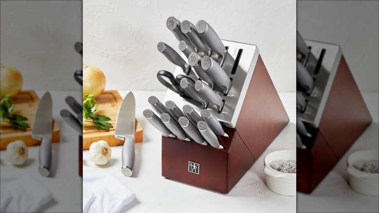 A Henckels Modernist Self-Sharpening Knife Block Set sits on a kitchen counter