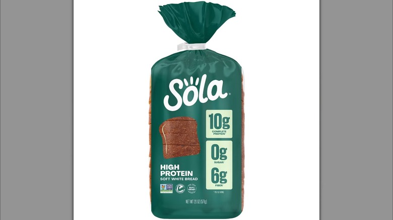 A package of Sola High Protein Soft White Bread against a white background.