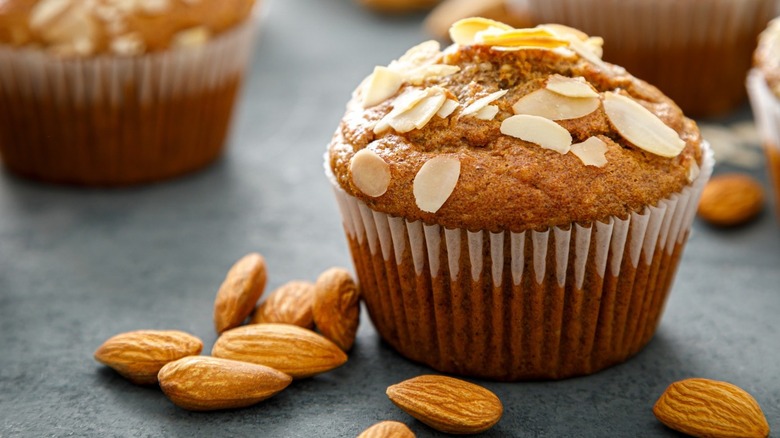 close-up of almond muffin and almonds