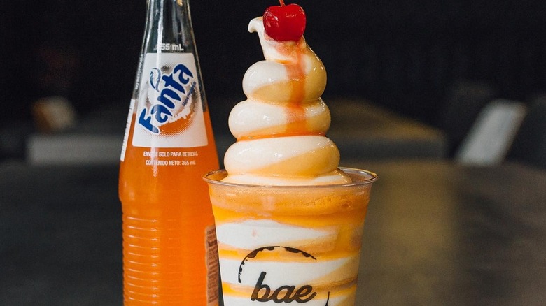 Fanta orange soda on top of ice cream
