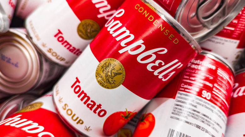 A jumbled pile of Campbell's soup cans